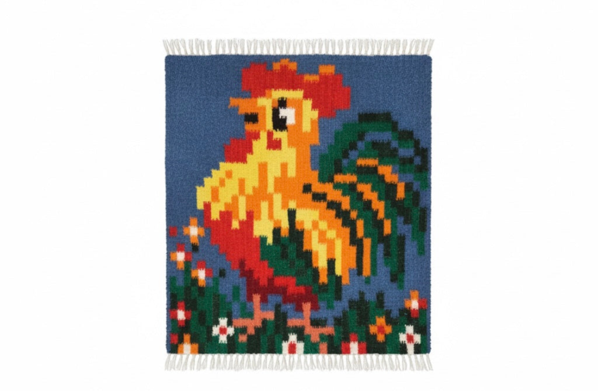 Woven blanket with a rooster design on a blue background